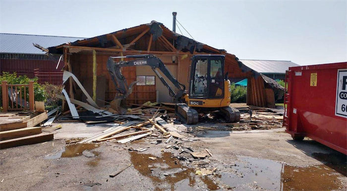 excavator at a home demo