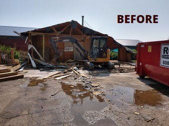 Vehicles clearling land infront of a church