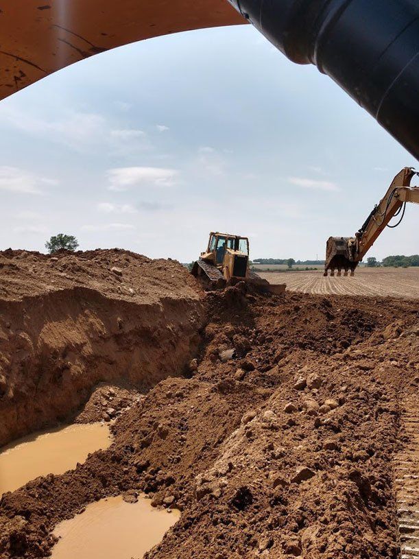Excavator and a bulldozer working in the dirt